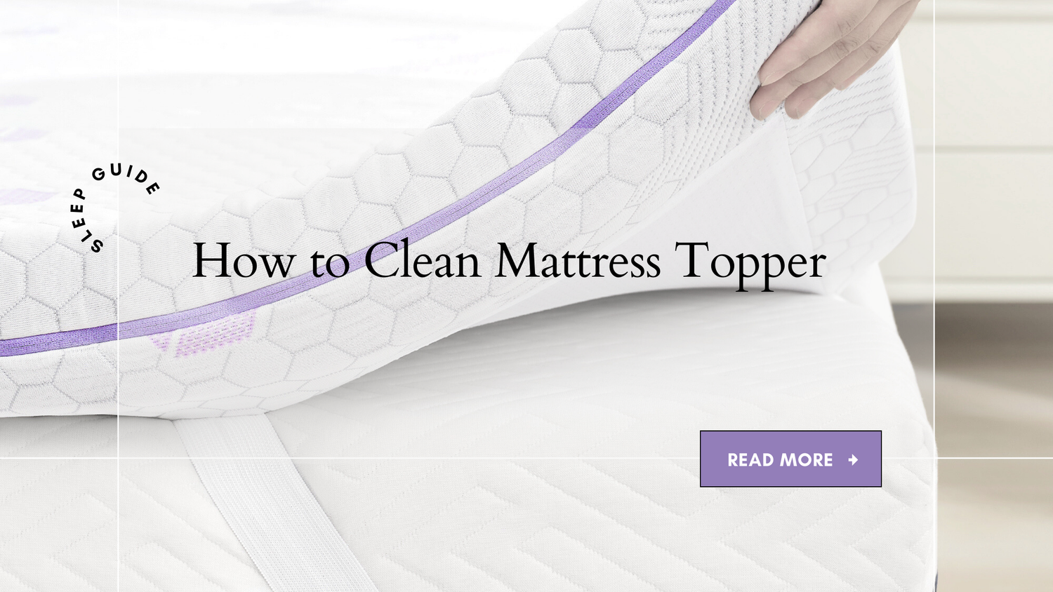 a hand lifting up a mattress topper with washable cover