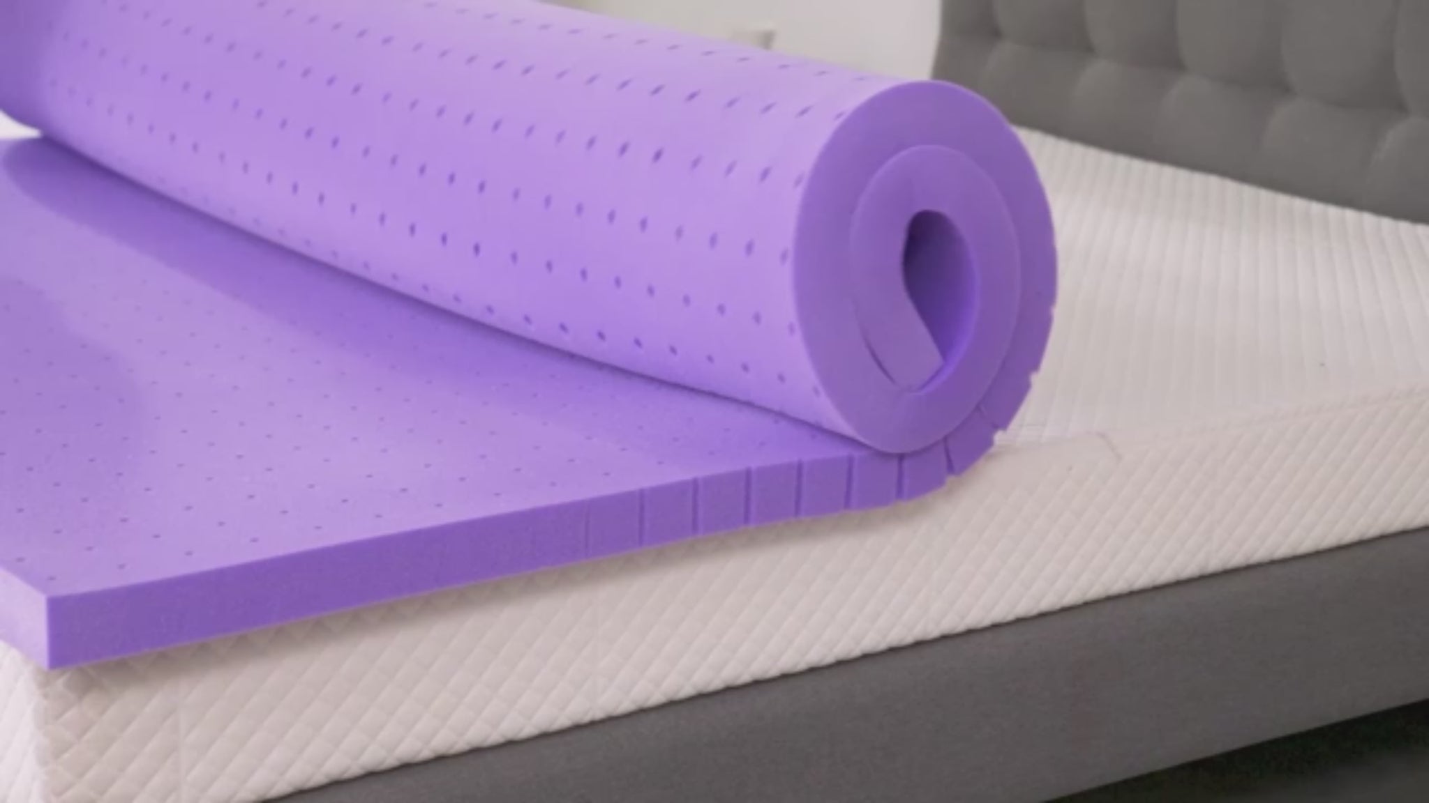 A mattress topper is unfolding